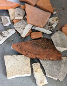 a pile of rubble sitting on top of a cement floor