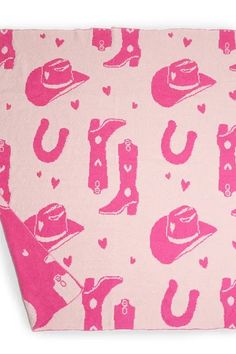 a pink bandana with cowboy hats and horseshoes on it