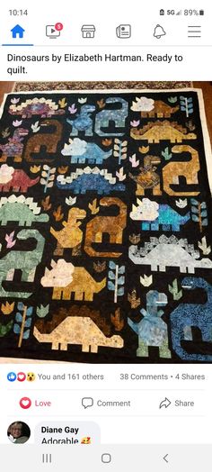 the quilt is made to look like dinosaurs