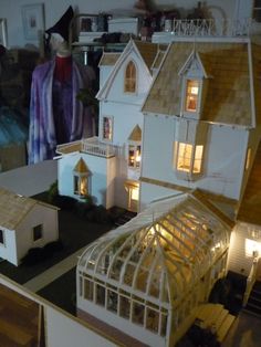 a doll house is lit up at night