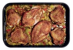 chicken and vegetable casserole in a baking dish on a white background with clippings