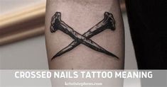 crossed nails tattoo meaning on the arm