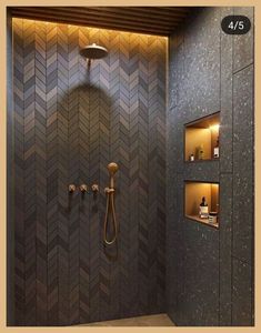 a bathroom with a walk in shower and tiled walls