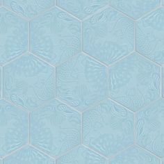 a blue tiled wallpaper with an intricate pattern in the shape of hexagonal tiles