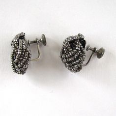 "Wonderful pair of Art Deco or earlier earrings! Four strands of cut steel beads are strung on wire twisted, and tied up in a pretty knot. Silver-tone metal crew-back findings hold these firmly on your ear. These are in excellent condition and measure 3/4\" x 3/4\"." Silver Round Bead Costume Earrings, Vintage Silver Beaded Drop Earrings, Vintage Silver Beaded Earrings, Wired Earrings, European Cut Diamond Ring, Art Deco Pink, Great Falls, European Cut Diamonds, Art Deco Era