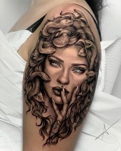 a woman's face with snakes on her arm