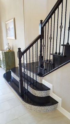 a black and white stair case in a house