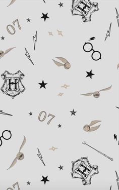 harry potter wallpaper with hogwarts and wands on the side, in black and white