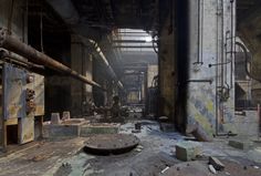 an abandoned industrial building with lots of rust