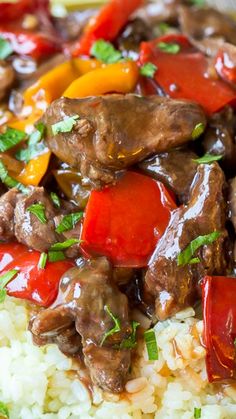 a plate with rice, meat and vegetables on it