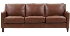 a brown leather couch sitting on top of a white floor