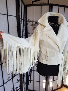 White suede jacket with beautiful fringe and silk lining. The blouse is made by chiffon. You can order black, white, beige color.    You can wear it with all you want. It's ideal part of romantic outfit and the same best couple with sneakers, blouse or t-shirt. It's good for all styles. I do a clothes for you with all my love but it takes some time. The jacket from photo I have in stock size M, but if you need another size the best will be to do your own jacket, made for your perfect measurement Fringed Jacket Outfit, Beige Tasseled Outerwear For Spring, Beige Tasseled Spring Outerwear, White Long Sleeve Outerwear With Tassels, Cream Long Sleeve Fringe Outerwear, Cream Fringe Outerwear For Winter, Cream Fringe Outerwear For Fall, Elegant Winter Outerwear With Tassels, Fitted Fall Outerwear With Tassels