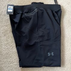 Brand New Joggers Black Techwear Workout Bottoms, Black Gym Bottoms With Hip Pockets, Under Armour Bottoms With Pockets For Streetwear, Under Armour Streetwear Bottoms With Pockets, Under Armour Black Sweatpants With Pockets, Black Gym Pants With Side Pockets, Black Sports Pants With Hip Pockets, Sporty Black Joggers With Hip Pockets, Black Sweatpants With Hip Pockets For Sports