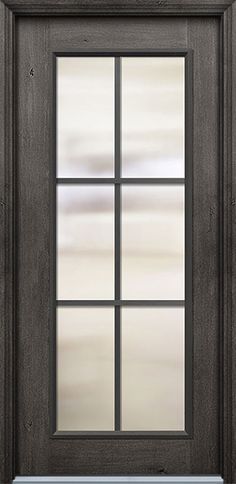 the front door is made from wood and has frosted glass panels on each side