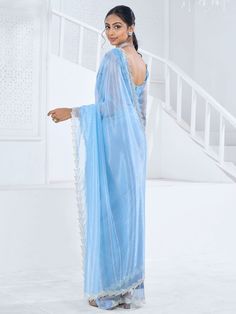 This saree is crafted from luxurious organza material in a captivating sky-blue color with intricate Swarovski work all over. The saree is adorned with a heavy handwork border, adding a touch of sophistication and elegance to the overall look. Paired with a matching organza blouse featuring zircon work, this ensemble is perfect for receptions, parties, festivals, or any special occasion.
This saree includes its gorgeous sky-blue color that exudes charm and elegance. The Swarovski work all over t Engagement Gown, Organza Material, Lehenga Crop Top, Lehenga Choli Wedding, Floral Lehenga, Party Wear Lehenga Choli, Reception Gown, Bollywood Lehenga, Cocktail Wear