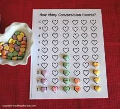 conversation hearts are shown next to a bowl of candy