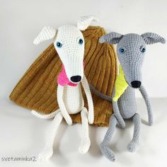 two crocheted animals sitting next to each other