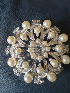 Approximately 3 inches.  See pictures for details.  This brooch is stunning and in excellent condition.  Stamped Nolan Miller on back.  d Formal Silver Pearl Brooch, Silver Pearl Brooch For Anniversary, Nolan Miller, Crystal Brooch, Faux Pearl, Brooch Pin, Brooches, Etsy Accessories, Silver Tone