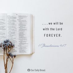 an open bible and some flowers on top of it with the words we will be with the lord forever