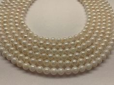 "Details We carry large section of akoya pearls collection on Etsy.com for wholesale price. 6.5-7.0 mm White Japanese Akoya Cultured Pearl, 16\", Cheap quality, would string to 18\" with knots clasp, Price per strand Good For wedding, graduation, anniversary. Pearl Information Lot111523-2 Surface markings and blemishesblemished/May have cracks on the pearls Shape                  Round Uniformity            Very-good Luster                  Lack-luster Minimum color  White  Size per pearl  6.5-7 Akoya Pearl Necklace With Round Beads, Single Strand Pearl Necklace With Round Beads, High Luster Round Akoya Pearl Necklace, Single Strand Round Pearl Necklace, White High Luster Round Beads Pearl Necklace, Classic Pearl Necklace With Gemstone Beads, White High Luster Pearl Necklace With Round Beads, Classic Round Pearl Necklace With Gemstone Beads, Formal Hand-strung Pearl Necklace With Round Beads