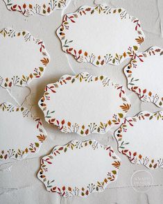 six decorative paper plates with leaves on them