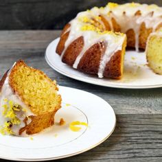 there is a bundt cake with lemons on the top and one half eaten