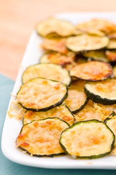 sliced zucchini arranged on a white plate