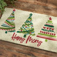 a door mat with christmas trees on it