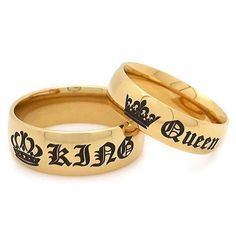 two gold wedding rings with the words queen and prince engraved on each one, set against a white background