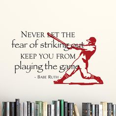 a wall decal with a baseball player hitting the ball and an inspirational quote above it