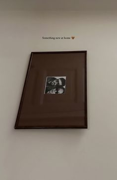 a framed photo hanging on the wall