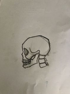 a drawing of a skull with one hand on it