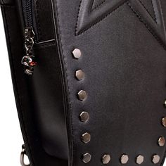 Unleash your inner Goth with the splendid Karma Bag from Lost Queen. Measuring approx. 20cm wide x 23cm tall (excluding handles) x 7cm deep, this versatile little piece has detachable shoulder straps so it can be used as a backpack, alternatively, whip them off & you've got a beautiful handbag! There's 15 hexagonal studs adorning the front plus a padded & stitched outline of a pentagram for added darkness. The main compartment is secured by a zip with a silver skull shaped pull and there's a pou Punk Style Rectangular Bag With Zipper Closure, Punk Style Backpack With Adjustable Strap, Alternative Leather Bag With Zipper Closure, Alternative Style Rectangular Bags For Daily Use, Alternative Style Rectangular Bag For Daily Use, Gothic Crossbody Shoulder Bag With Zipper Closure, Gothic Crossbody Shoulder Bag With Zipper, Gothic Shoulder Bag With Zipper Closure For Daily Use, Alternative Bags With Zipper Closure For Daily Use