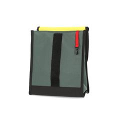 a black and grey bag with yellow accents on the front, two red zippers at the bottom