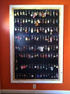 a display case filled with lots of different kinds of keychains on it's sides