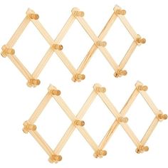 four wooden pegs are arranged in the shape of squares