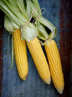 corn on the cob with leaves still attached