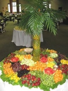 a table topped with lots of different types of fruits and veggies on top of it