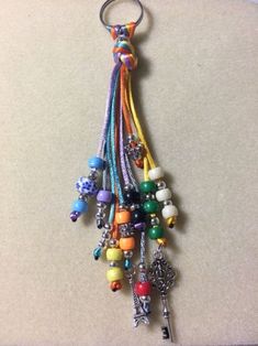 a bunch of beads hanging from a key chain