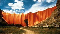 an orange cloth draped over a dirt road