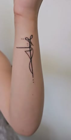 a woman's arm with a tattoo on it