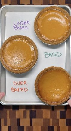 three pies sitting on top of a metal pan