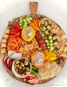 a wooden platter filled with different types of food