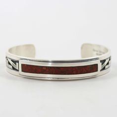 Sterling Silver Cuff Bracelet with Overlaid Designs and Coral Chip Inlay. .5” Cuff Width5.5” Inside Measurement, plus 1.125” opening(6.625" Total Circumference - Medium) Zuni Jewelry, Concho Belt, Navajo Jewelry, Native Jewelry, Sterling Silver Cuff Bracelet, Sterling Silver Cuff, Pendant Rings, Silver Cuff Bracelet, Black Stone