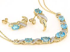 3.89ctw Swiss Blue Topaz With .01ctw Diamond 14k Yellow Gold Over Sterling Silver Necklace And Earring Set . Necklace Measures Approximately 0.21"W. Lobster Claw Closure. Earrings Measure Approximately 0.68"L x 0.20"W. Push Backings. Swiss Blue Topaz, Pandora Charm Bracelet, Blue Topaz, Sterling Silver Necklaces, Earring Set, Topaz, Silver Necklace, Charm Bracelet, Yellow Gold