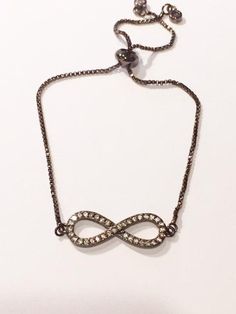 These dainty infinity chain bracelets are the perfect piece to stack into your other bracelets or wear on their own. The toggle slide allows this bracelet to fit just about anyone! The dangling end has two pretty rhinestones at the end. A perfect gift for anyone (Including yourself!). Infinity Chain, Chain Bracelets, Chain Bracelet, The End, Gold Necklace, Rose Gold, Perfect Gift, Pendant Necklace, Bracelet