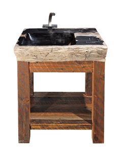 a sink made out of wood with a metal faucet on the top and bottom