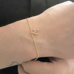 - Initial Bracelet for Women is made with high quality 14K real solid gold. - Initial Bracelet for women is with decorated white cubic zirconia stones. The length and width of the 14K gold initial letter is 6mm X 6mm. Its tickness is 2mm. -The bracelet length is 6.9 inches. Also there is a 1.18 inches 14K gold extender. The tip of the extender is decorated with a round white zircon stone. So you can arrange its length. - Its closure is 14K gold lobster claw style. Its chain is special. The ball Adjustable 14k Gold Birthday Bracelets, Elegant Initials Bracelets For Birthday, Adjustable 14k Gold Bracelets For Birthday, Dainty Yellow Gold Name Bracelet For Birthday, Adjustable 14k Gold Bracelet For Birthdays, Adjustable 14k Gold Bracelet For Birthday, Elegant Yellow Gold Charm Bracelet For Birthday, 14k Yellow Gold Bracelets For Birthday Gift, 14k Yellow Gold Bracelets For Birthday