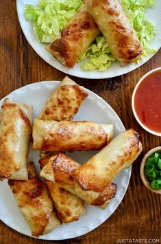 two white plates topped with food next to a bowl of sauce and another plate filled with food