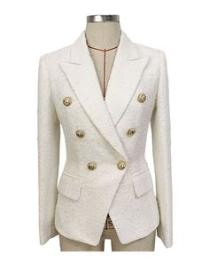 Delilah White Tweed Double Breasted Blazer with Gold Buttons - SLIM FITFeatures:- Slim Fit Design - Single Gold Button Closure - Gold Button Cuffs - Peak Lapels - Two Faux Side Pockets - Shoulder Padding The Delilah White Tweed Double Breasted Blazer is a crisp and fresh piece that adds a touch of sophistication to any outfit. The classic white colour is timeless and versatile, while the tweed fabric adds a touch of texture and depth. The blazer is made from a soft, tweed fabric that is both com White Tweed Jacket With Buttons For Winter, White Tweed Blazer With Button Closure, White Winter Tweed Jacket With Buttons, Winter White Tweed Jacket With Buttons, Chic White Tweed Jacket With Button Closure, Classic White Tweed Jacket With Buttons, Fitted Beige Tweed Jacket With Buttons, Elegant Fitted Button-up Tweed Jacket, Fitted Elegant Tweed Jacket